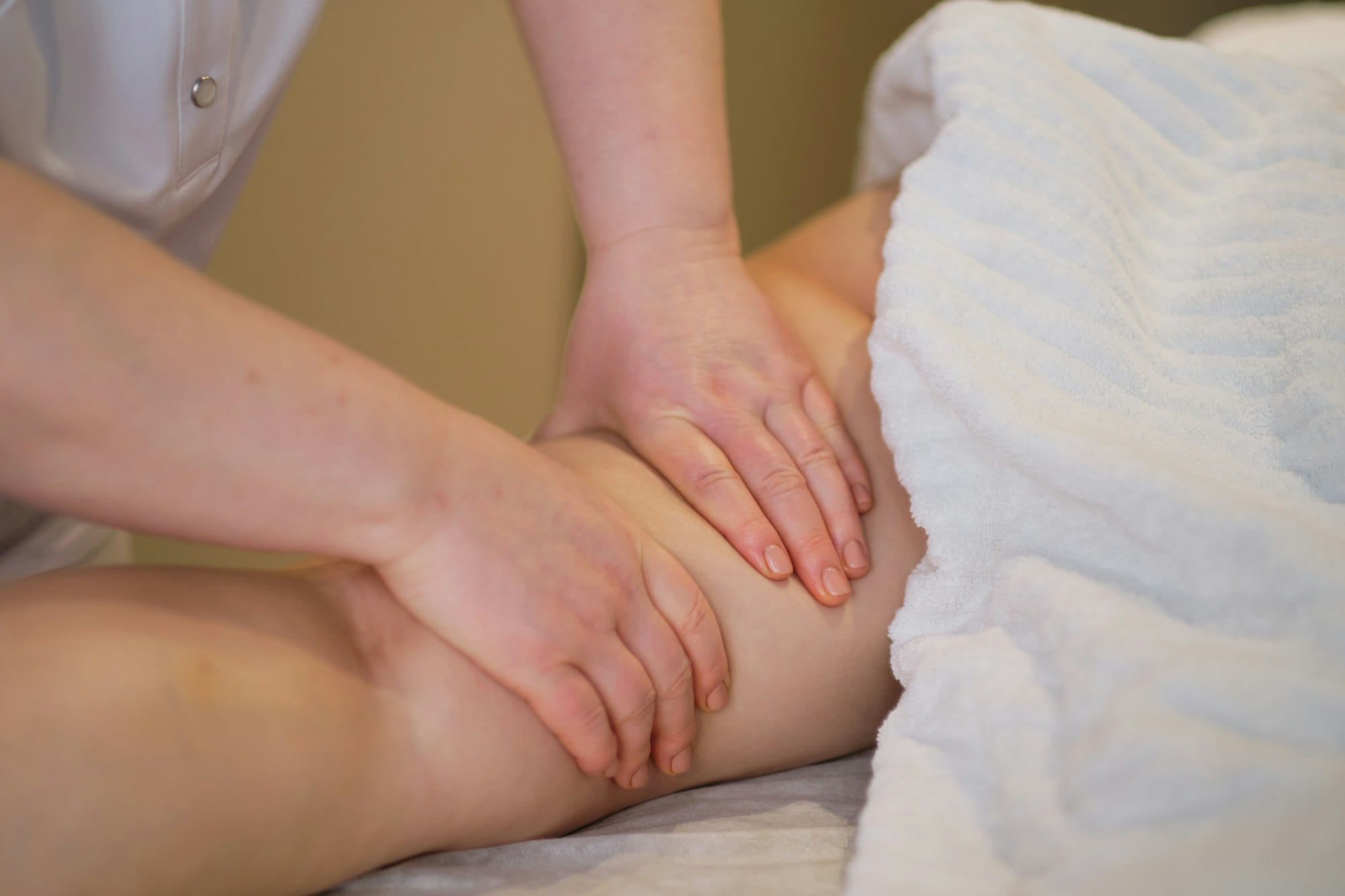 Female therapist providing a soothing lymphatic drainage massage for relaxation